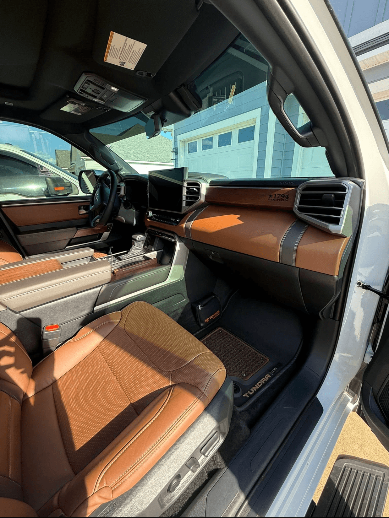 Toyota Tundra dashboard, console, and passenger floor cleaned after a mobile full detail