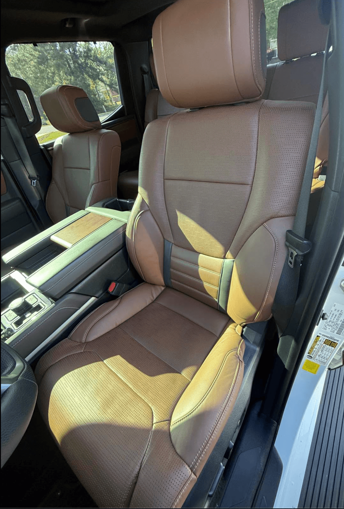 Brown leather driver's seat in a Toyota Tundra cleaned and conditioned during a mobile interior detail