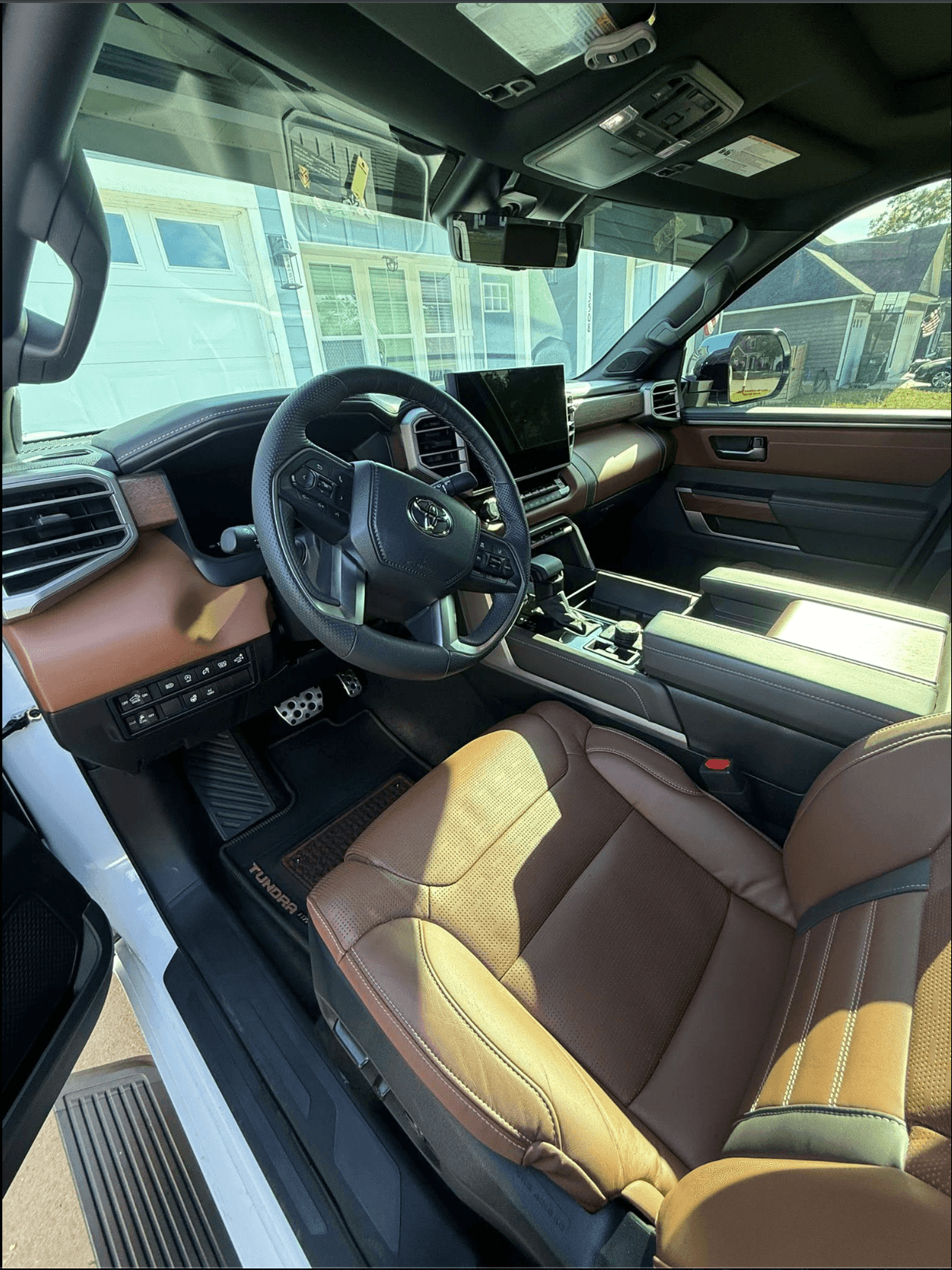 Toyota Tundra cabin after a full mobile detail — clean dash, console, and brown leather seats